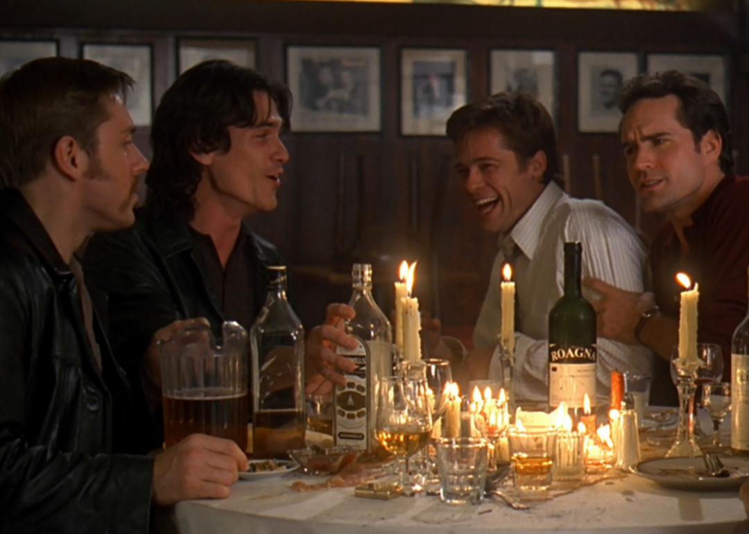 Brad Pitt, Jason Patric, Billy Crudup, and Ron Eldard laughing and drinking at a restaurant.
