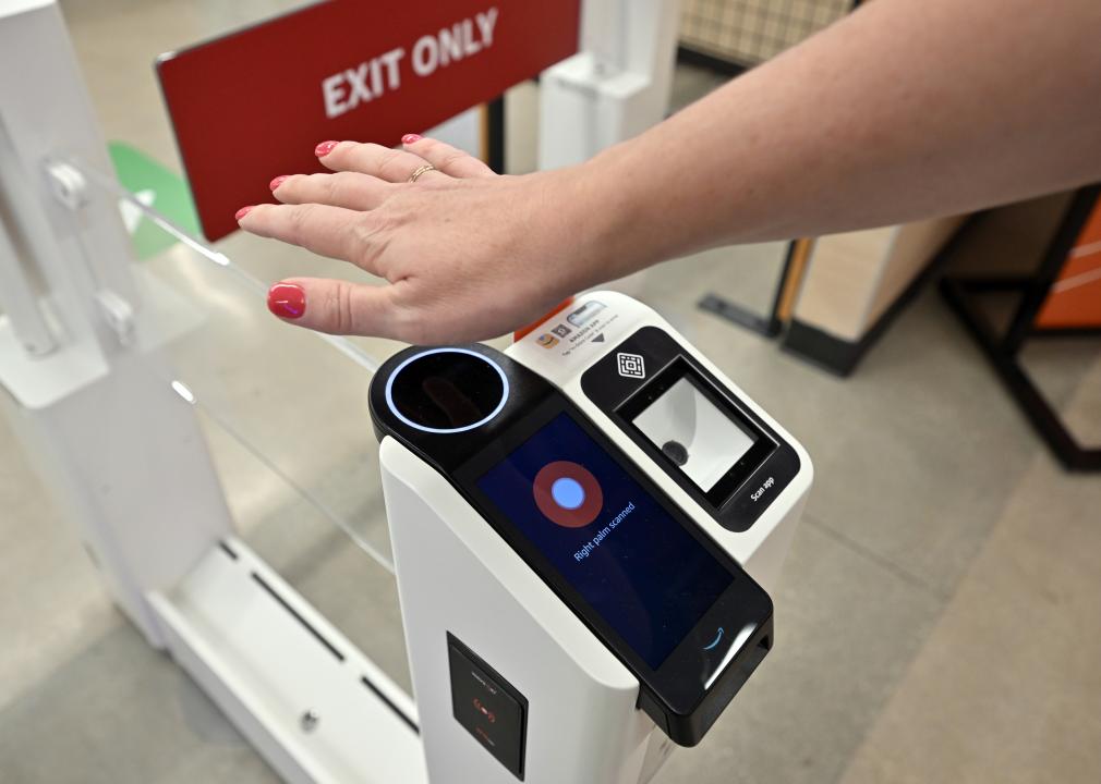 A person using the new walk out technology with a palm scan.