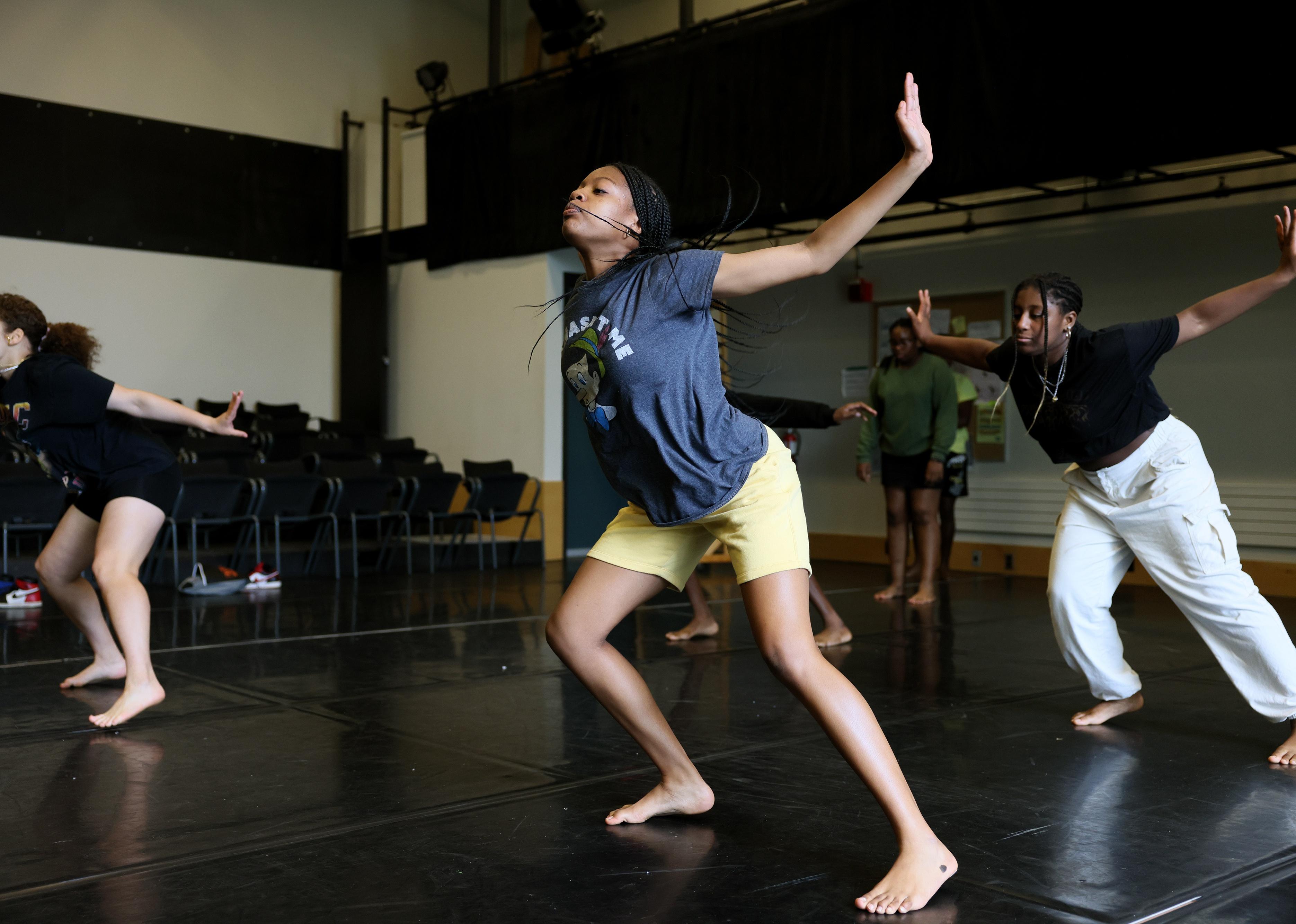 Teenagers learning choreography at a summer camp.