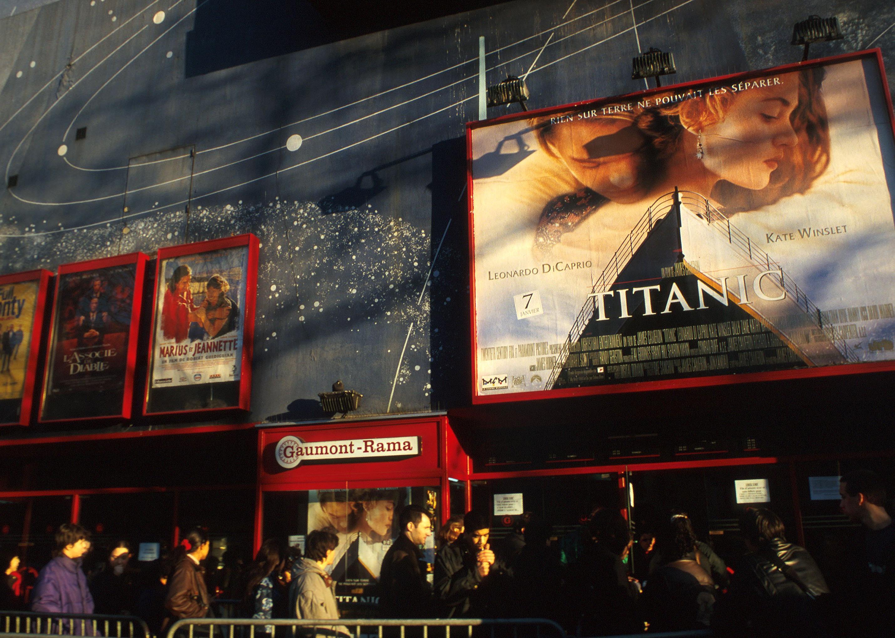 Advertisements for movies outside a theater, including one for Titanic, in 1998.