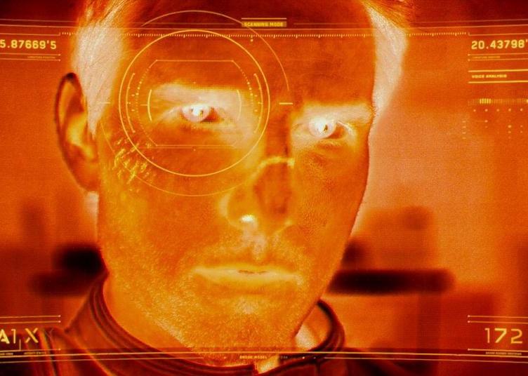 An infrared image of a man's face with something like a target on it.