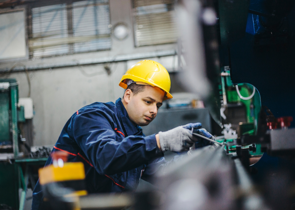 A sheet metal worker in a yellow hard hat.