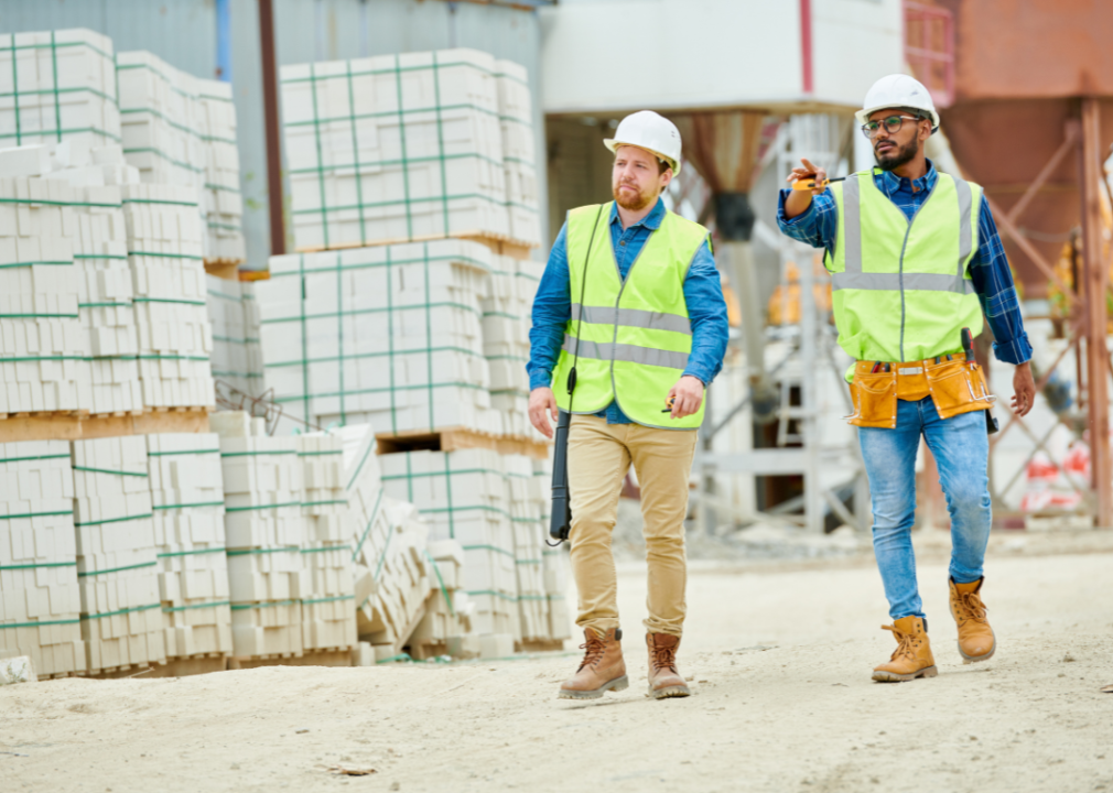 Building inspectors walking on a construction site.