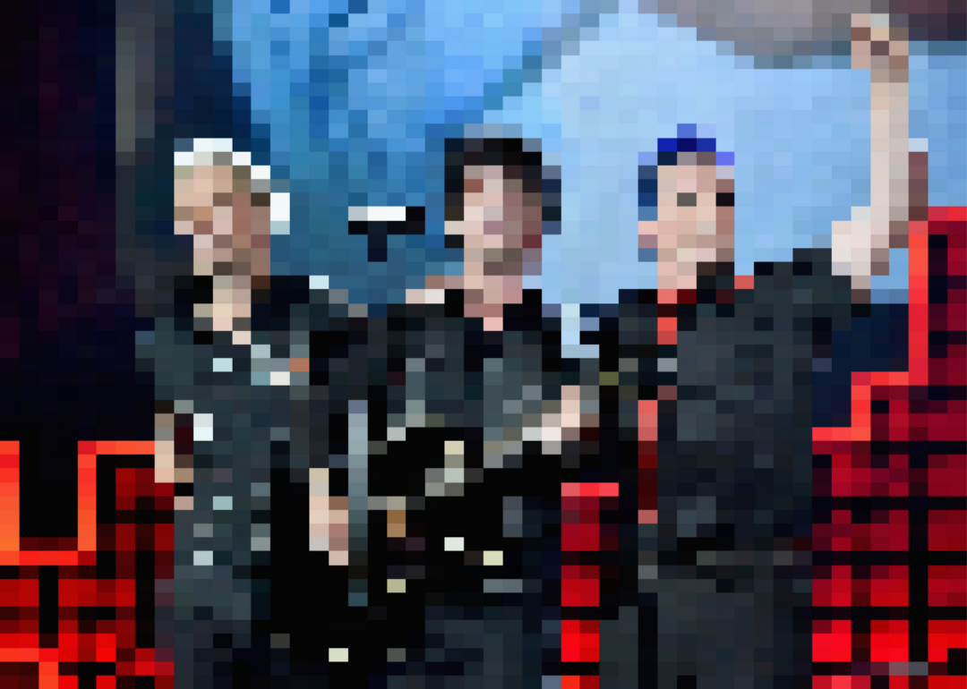 Green Day performing onstage.