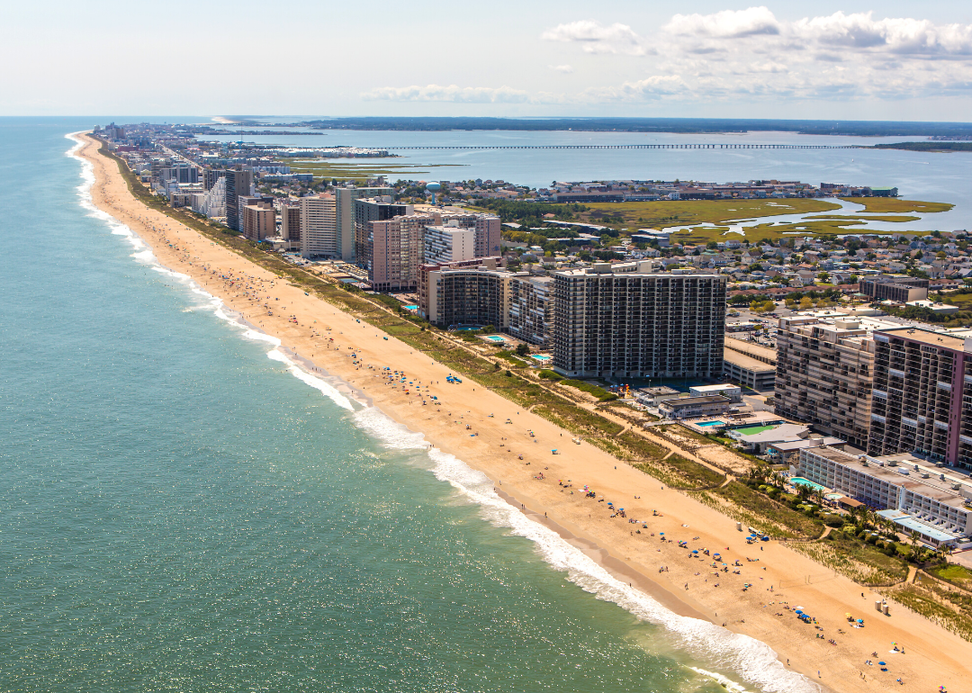 Aerial view of beach front and buildings.