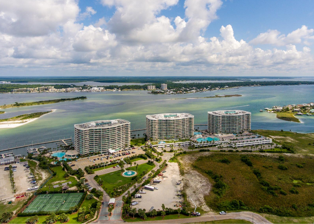 Aerial view of waterway and high rise community.