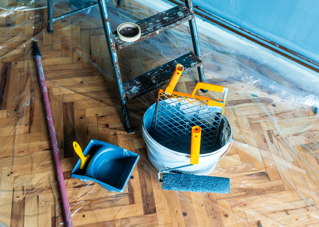 Painting tools on a floor.