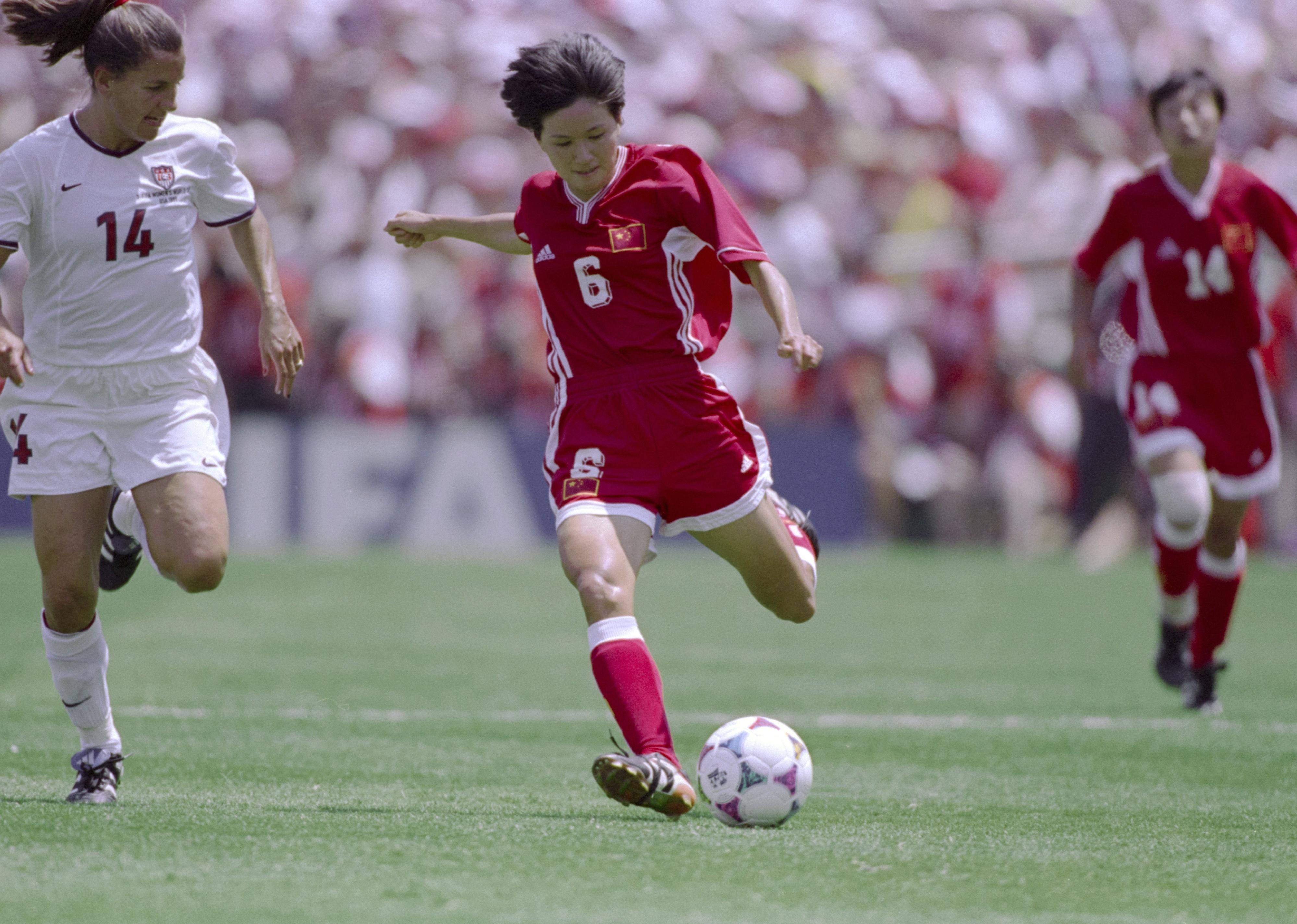 Zhao Lihong and Joy Fawcett in motion during the Final match of the FIFA Women's World Cup 1999.