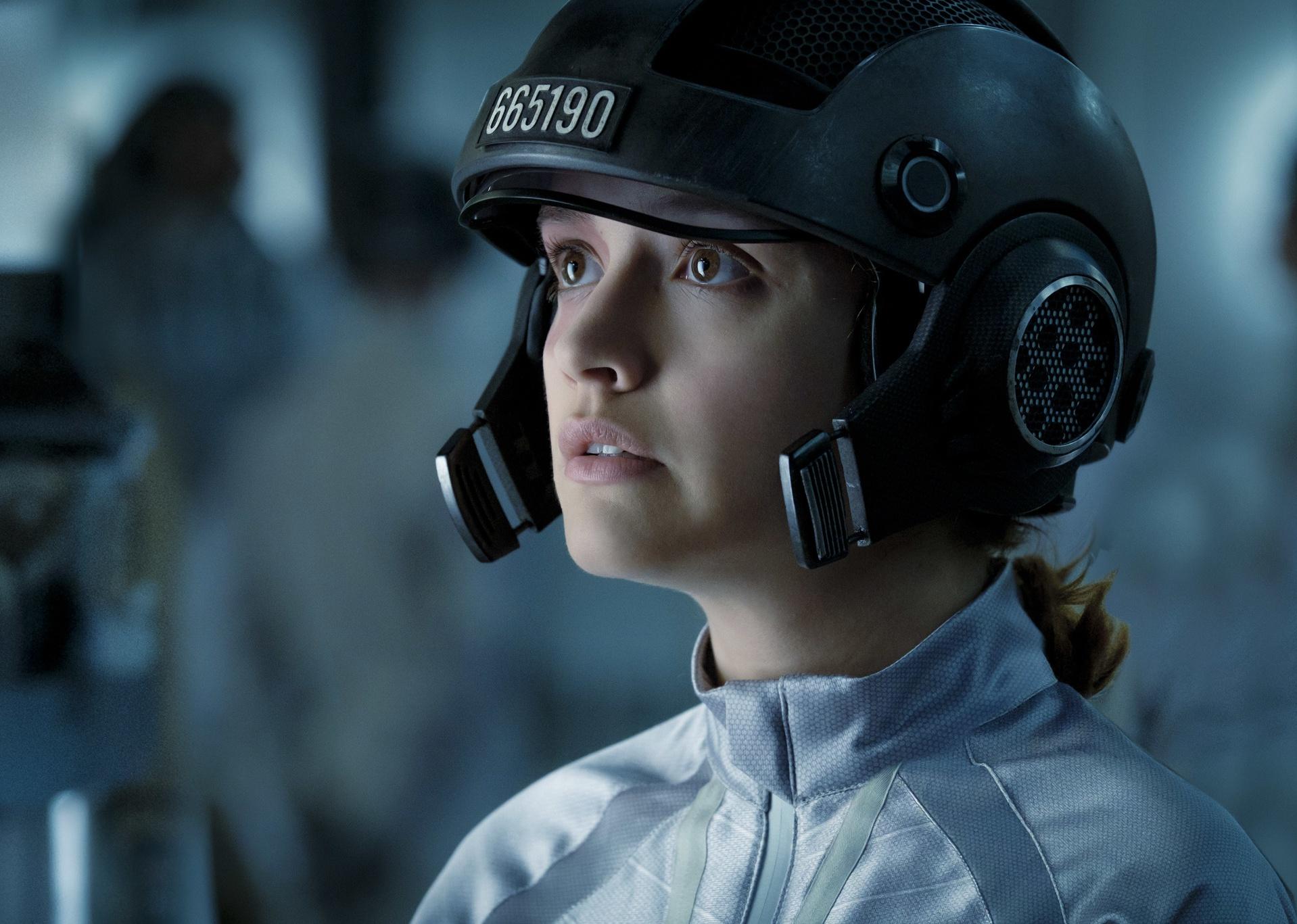 Olivia Cooke wearing a gaming helmet.