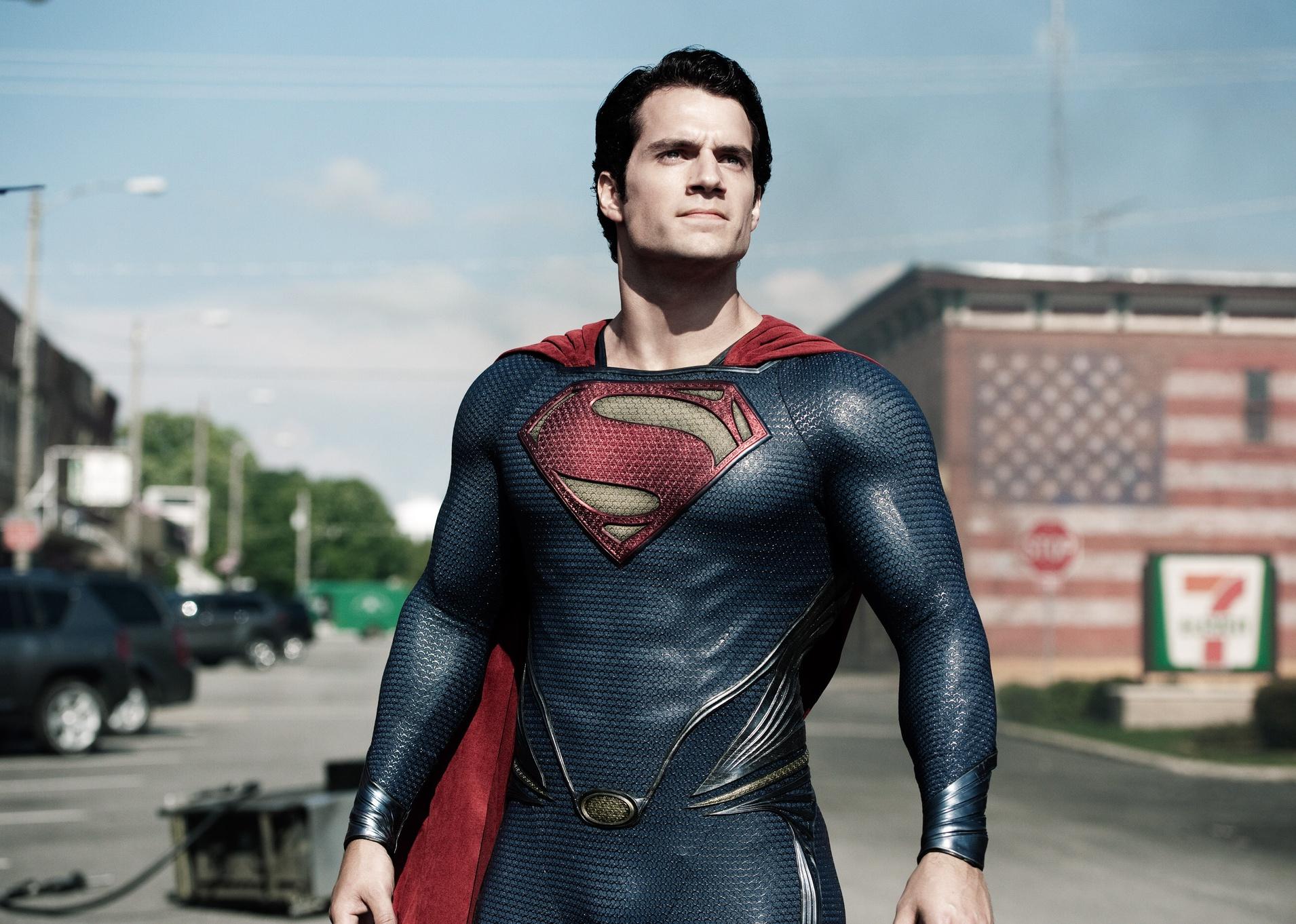 Superman standing in the middle of the street.