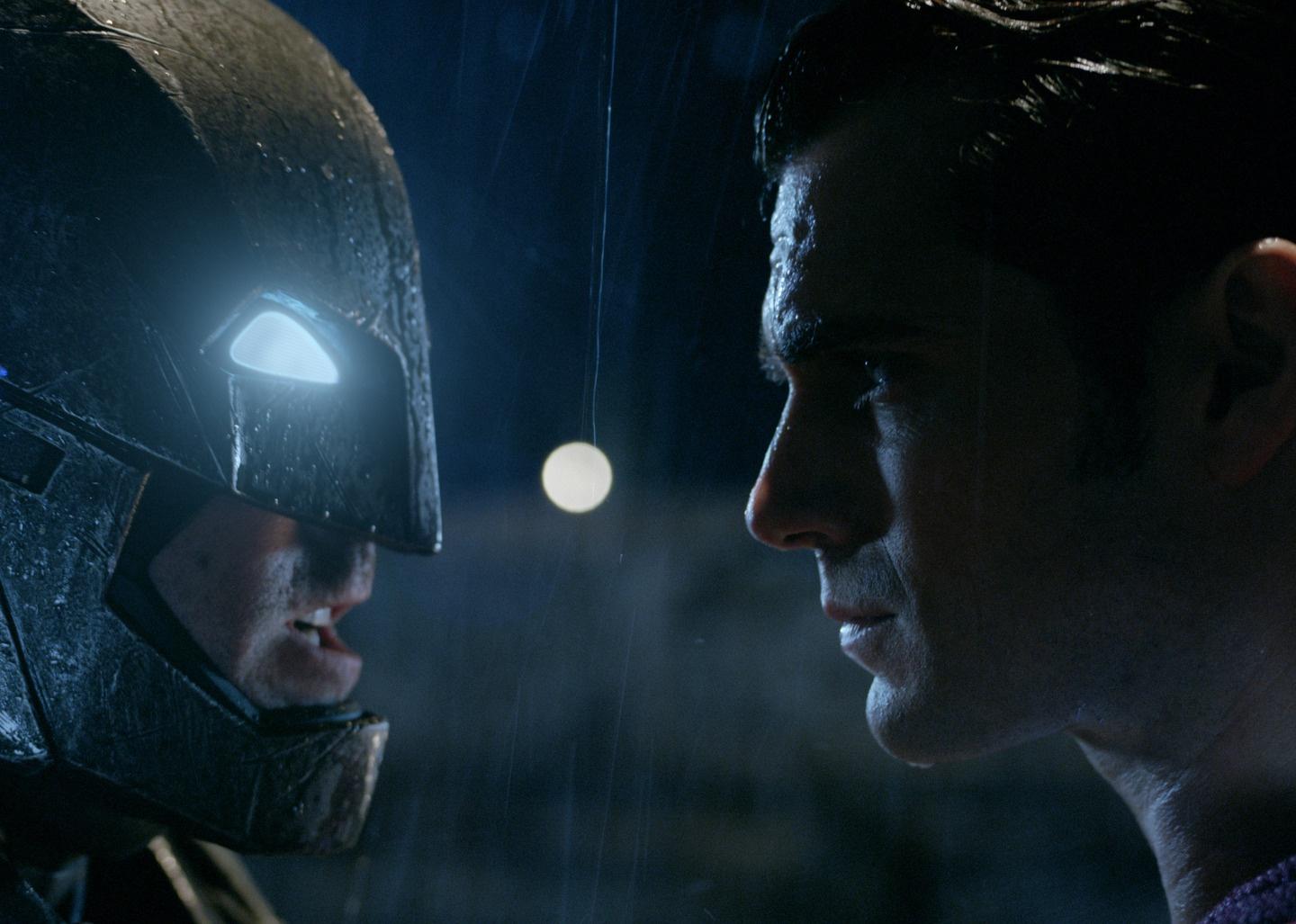 Ben Affleck as Batman and Henry Cavill as Superman face to face.