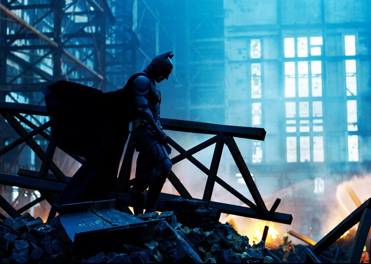 Christian Bale in a black Batman costume.
