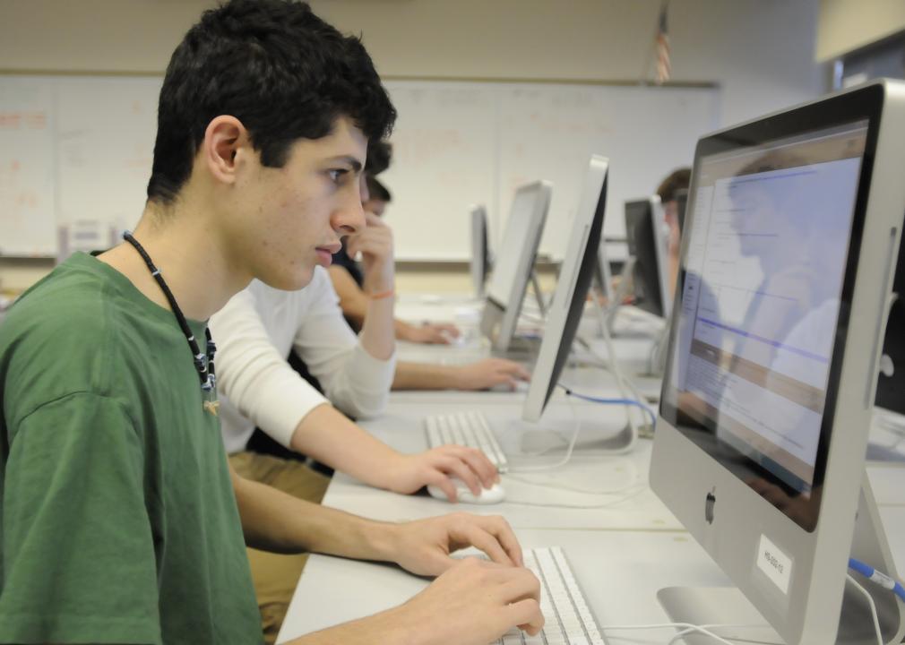 Student works on writing code in Java