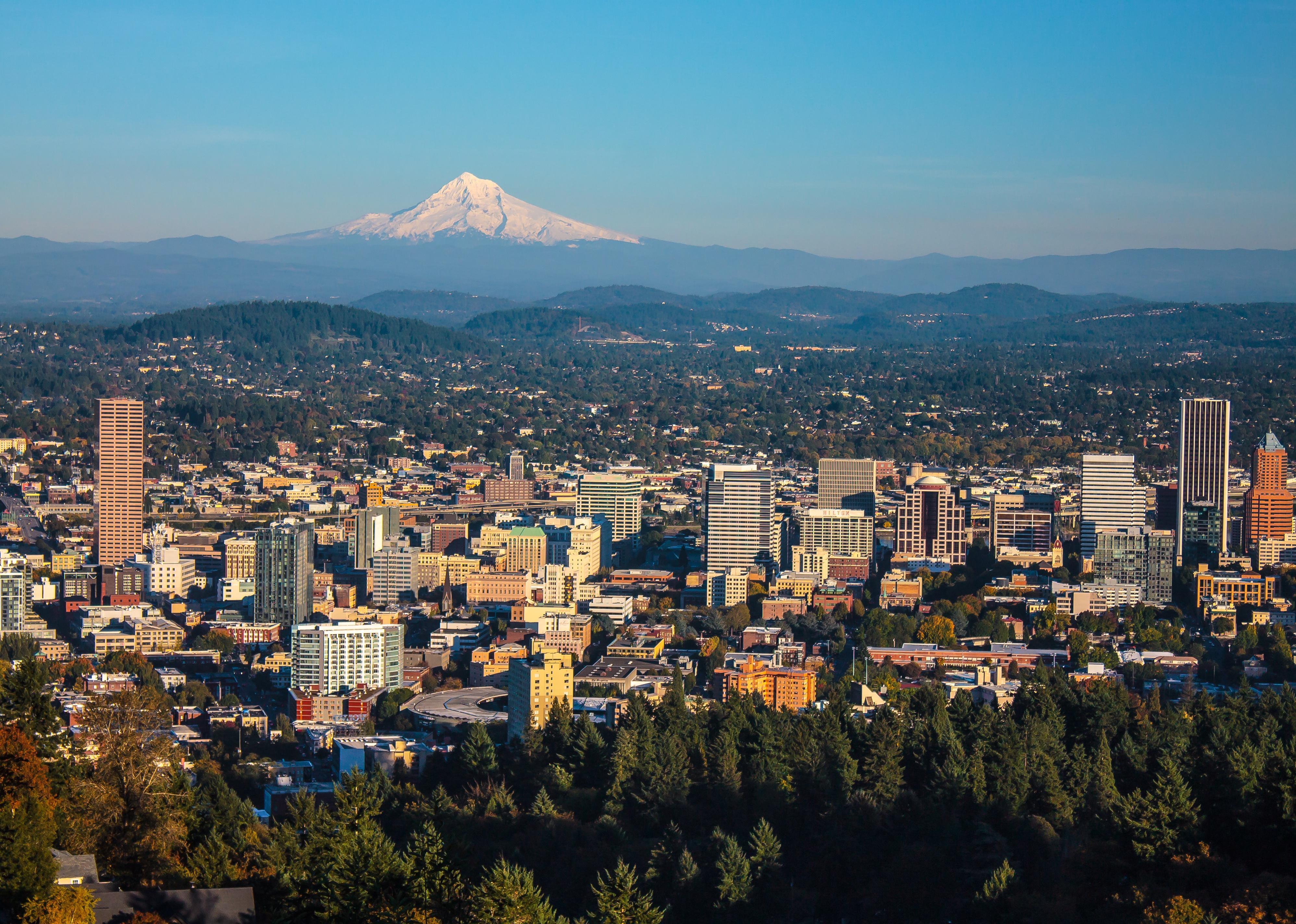 Aerial view of Portland, Oregon, with Mt. Hood towering in the distance.