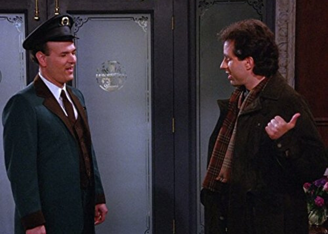 Jerry talks to a doorman. 