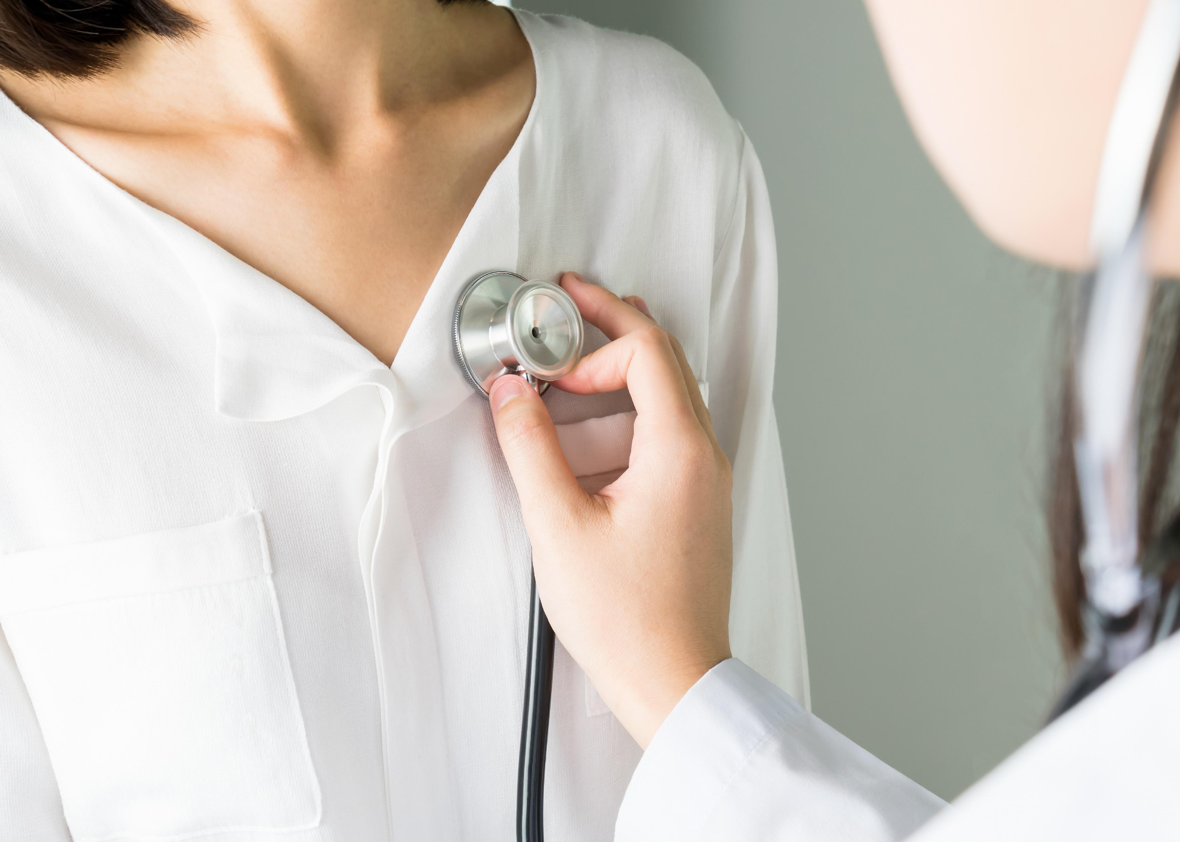 Doctor is using a stethoscope for patient examination.