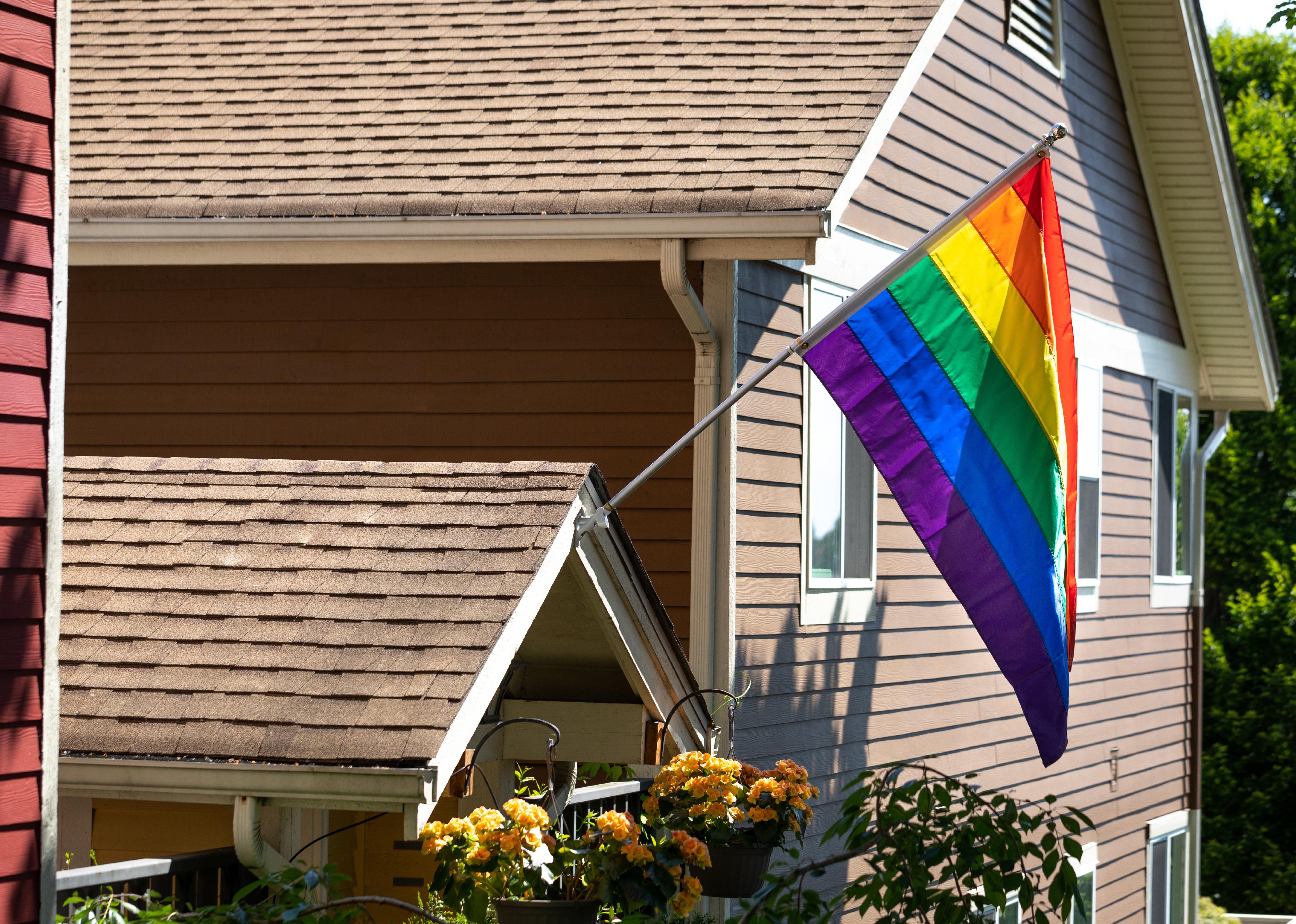 Rainbow Pride flag on the front of a residential house