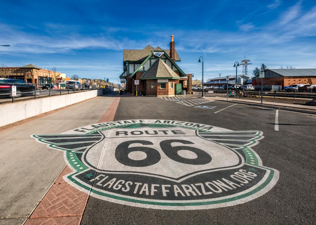 Route 66 logo on the ground in front of historic train station