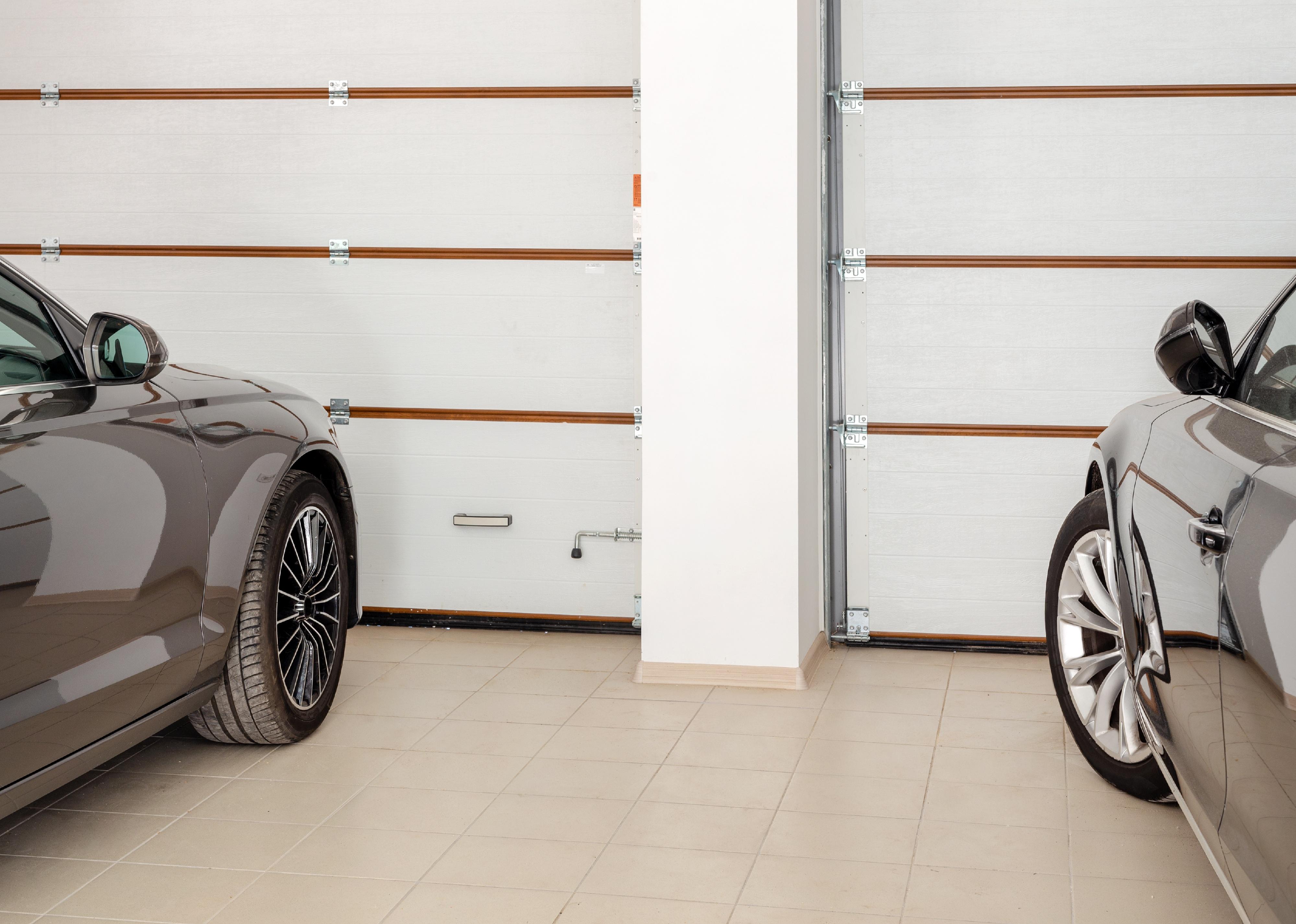 Home garage with two vehicles, interior.