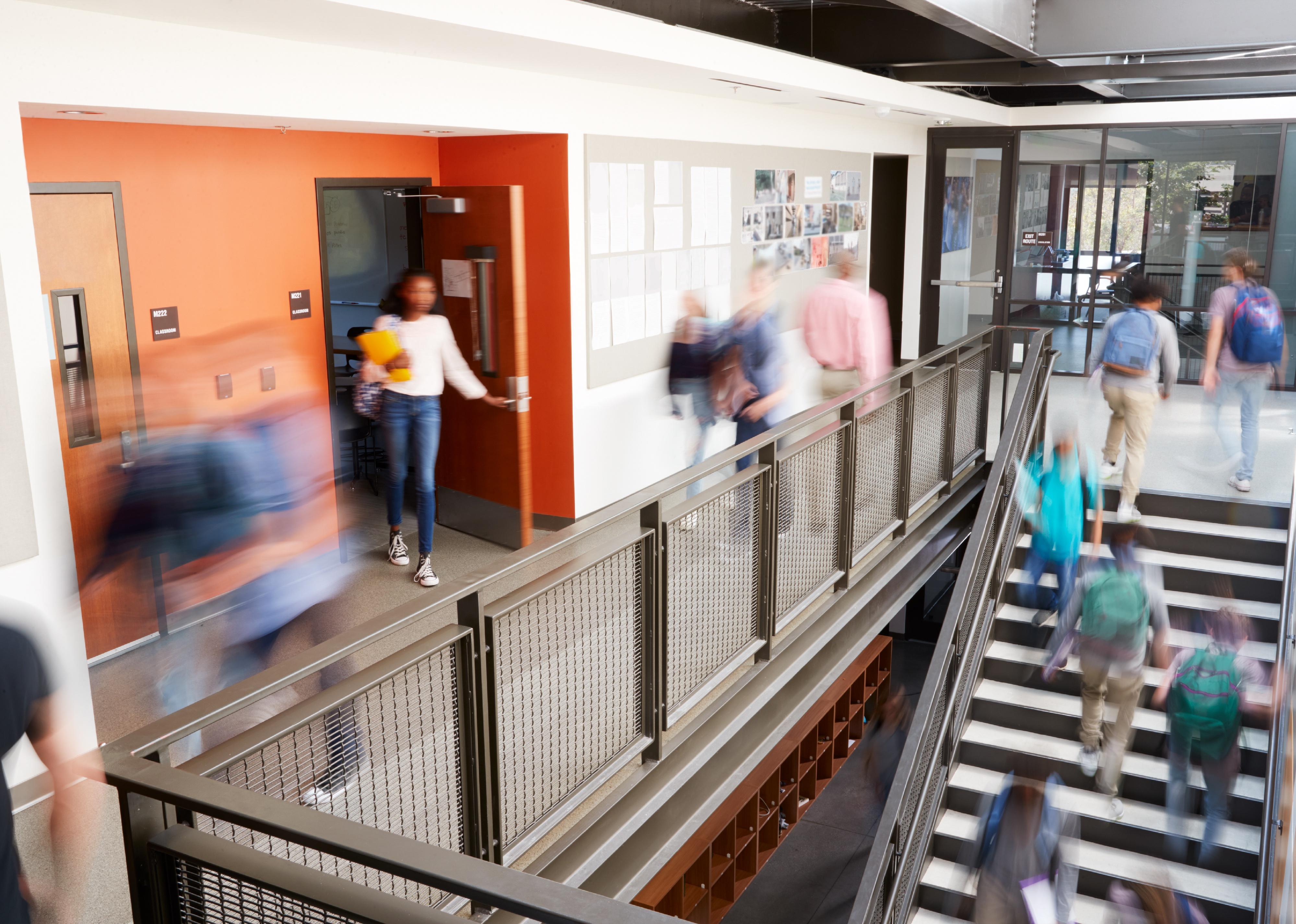 Busy and blurred high school hallway