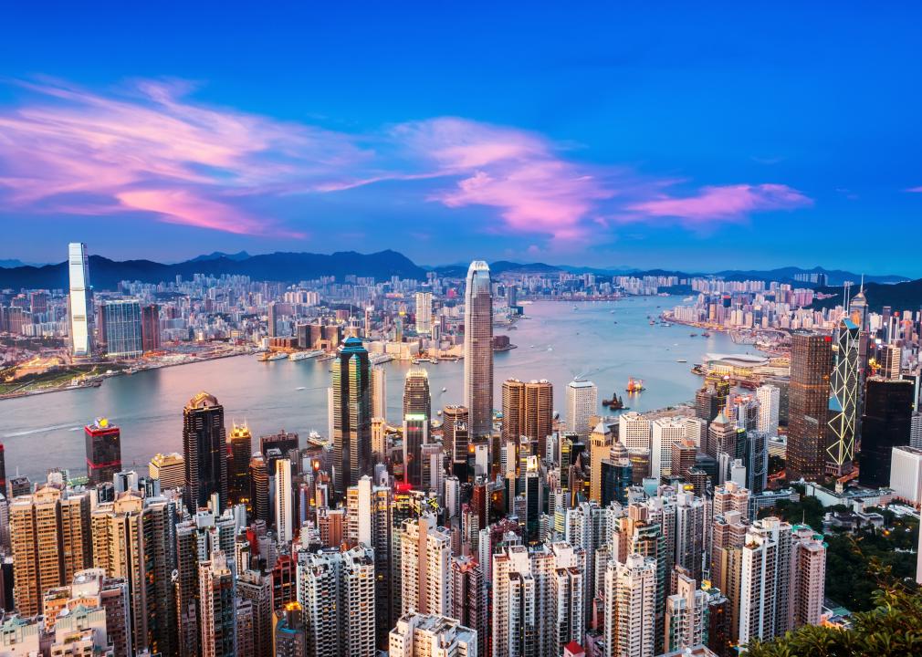 An aerial view of Hong Kong with with a blue and pink sunset sky.