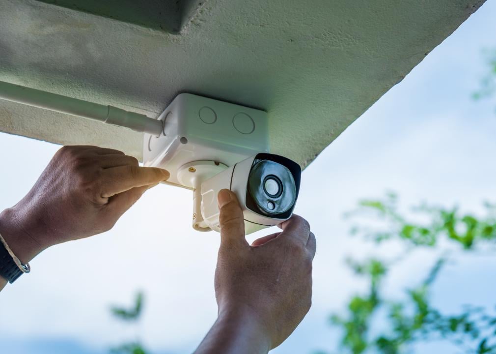 Technician installing IP wireless CCTV camera