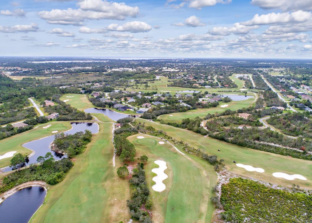 Aerial view of golf course and residential homes.