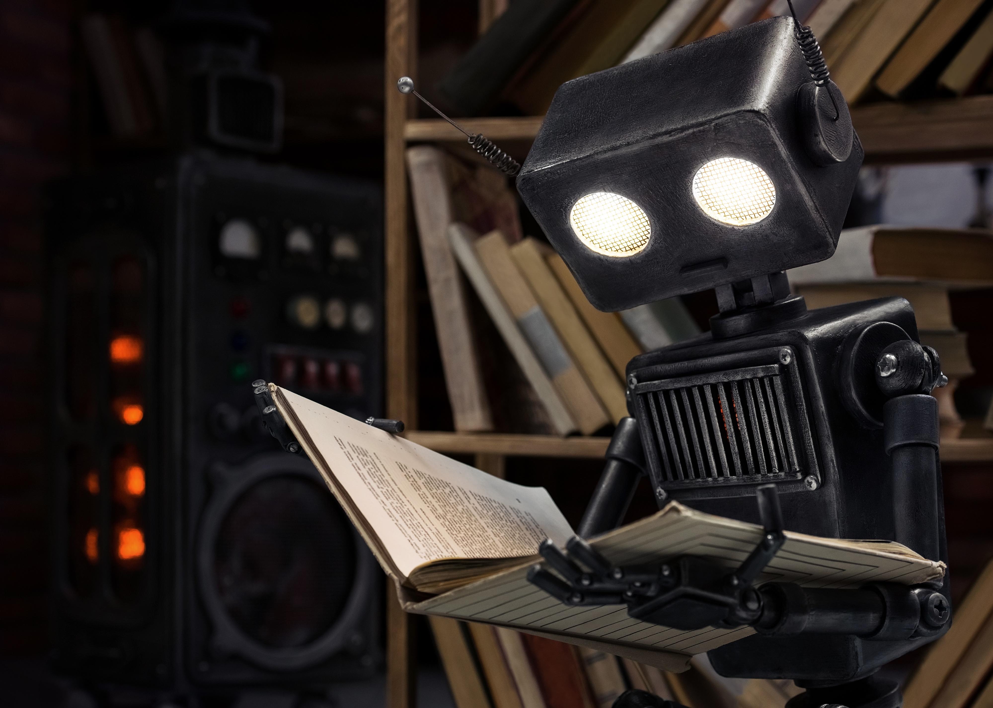 Robot reading a book. 