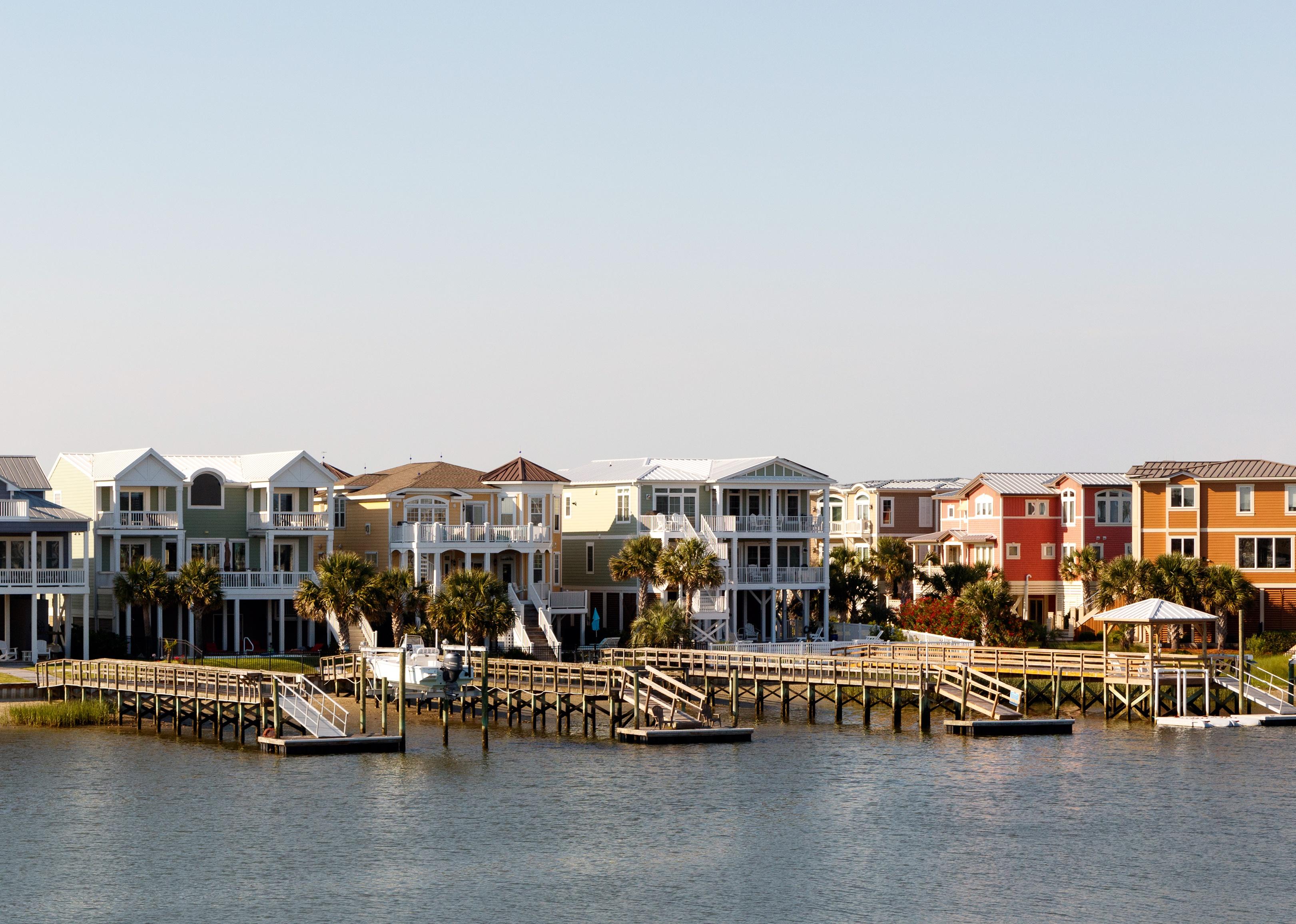 Wide angle view of luxury beach rental houses on the intercoastal waterway.
