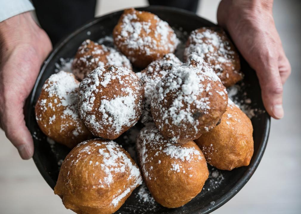Traditional oliebollen piled on a plate.