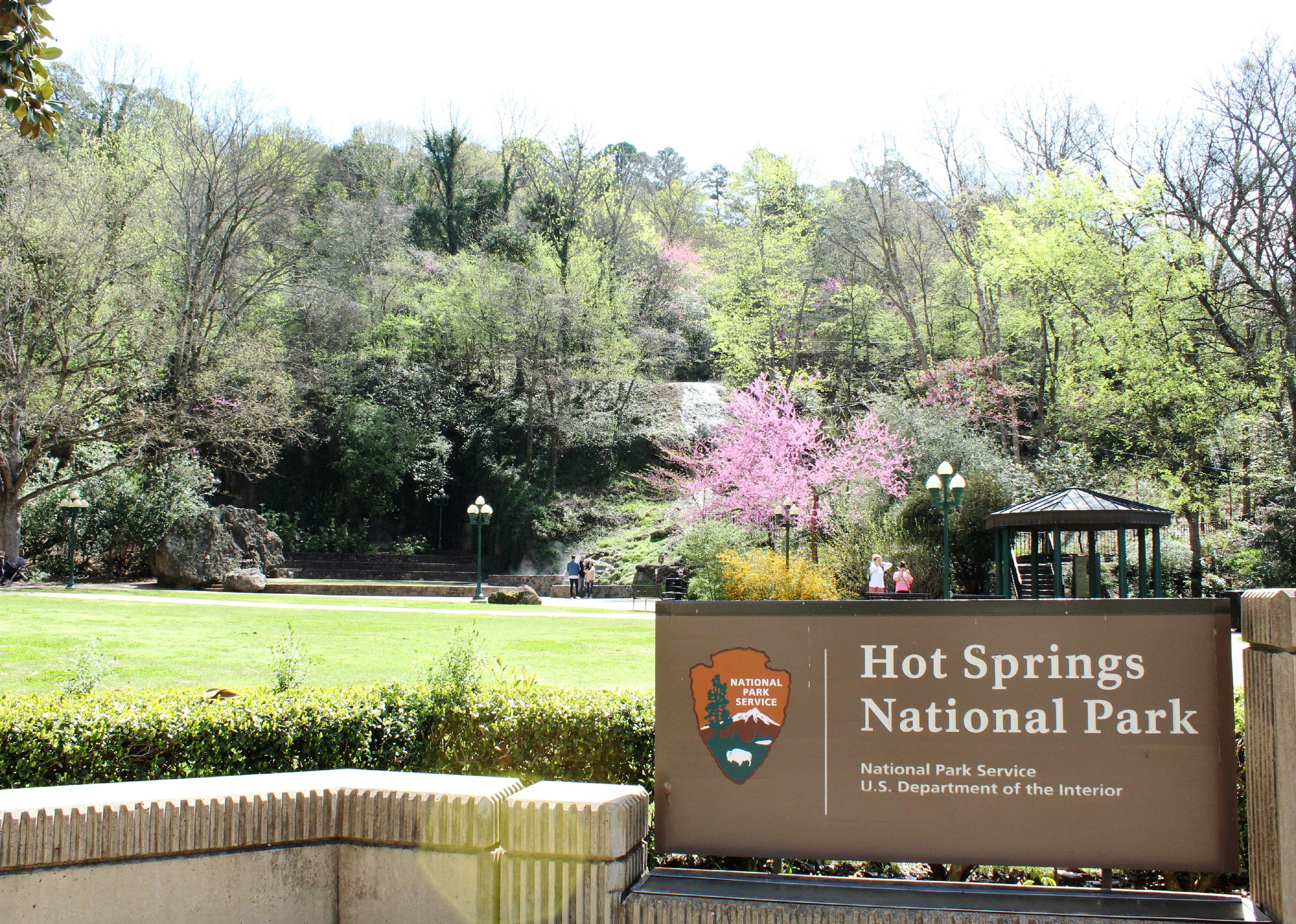 Sign in foreground greets visitors to Hot Springs National Park.