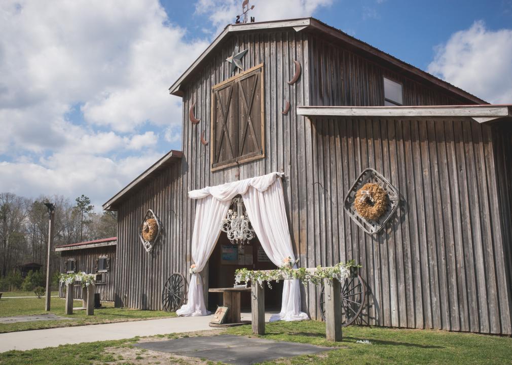 Old wooden barn decorated for wedding ceremony.