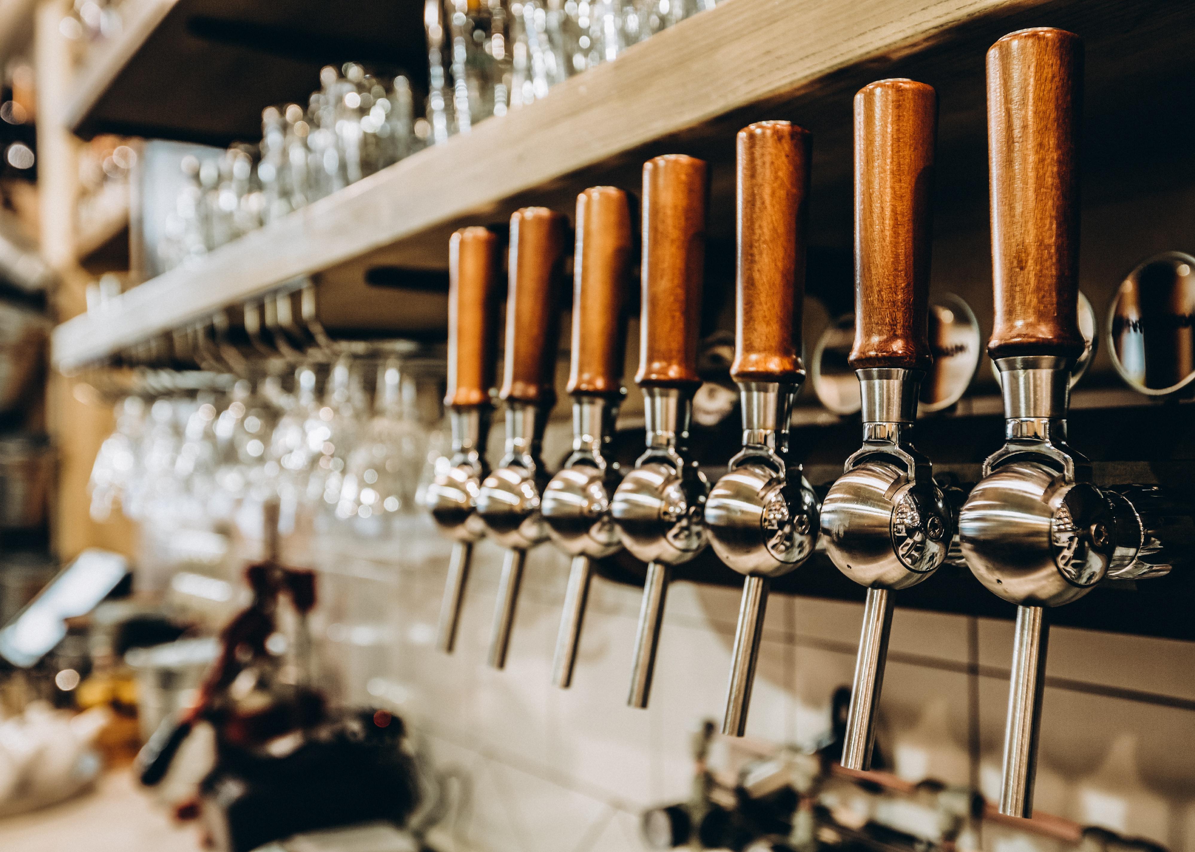 Shiny beer tap with wooden handle
