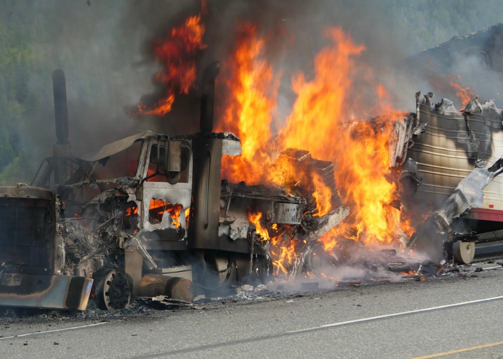 Semi truck burning on a highway