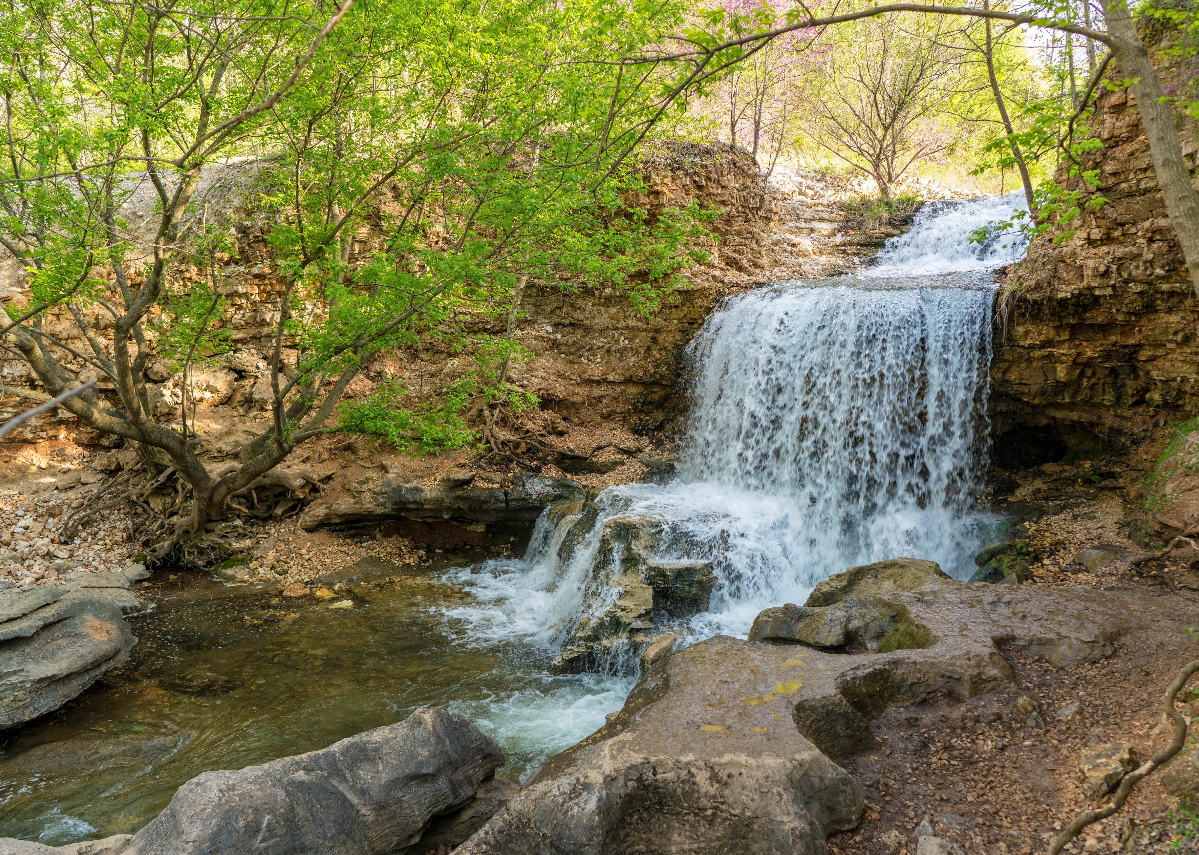 Waterfall in wood area in spring.
