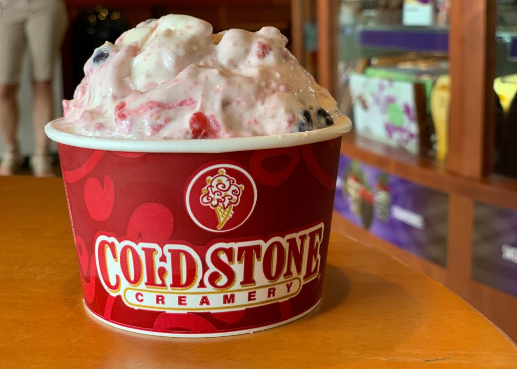 Ice cream in a cup on a table. 