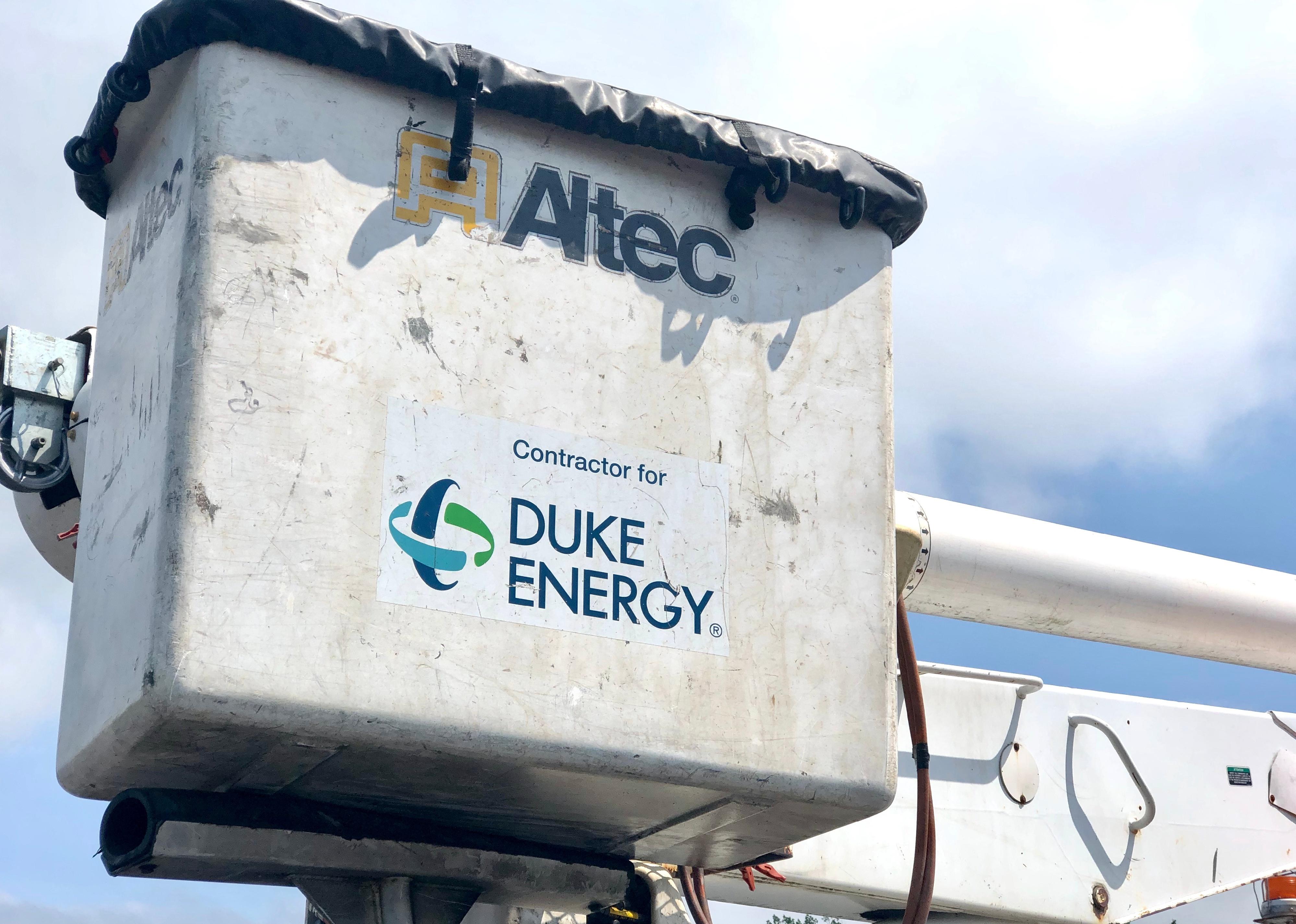 An electrical repair truck with the logo for Duke Energy.