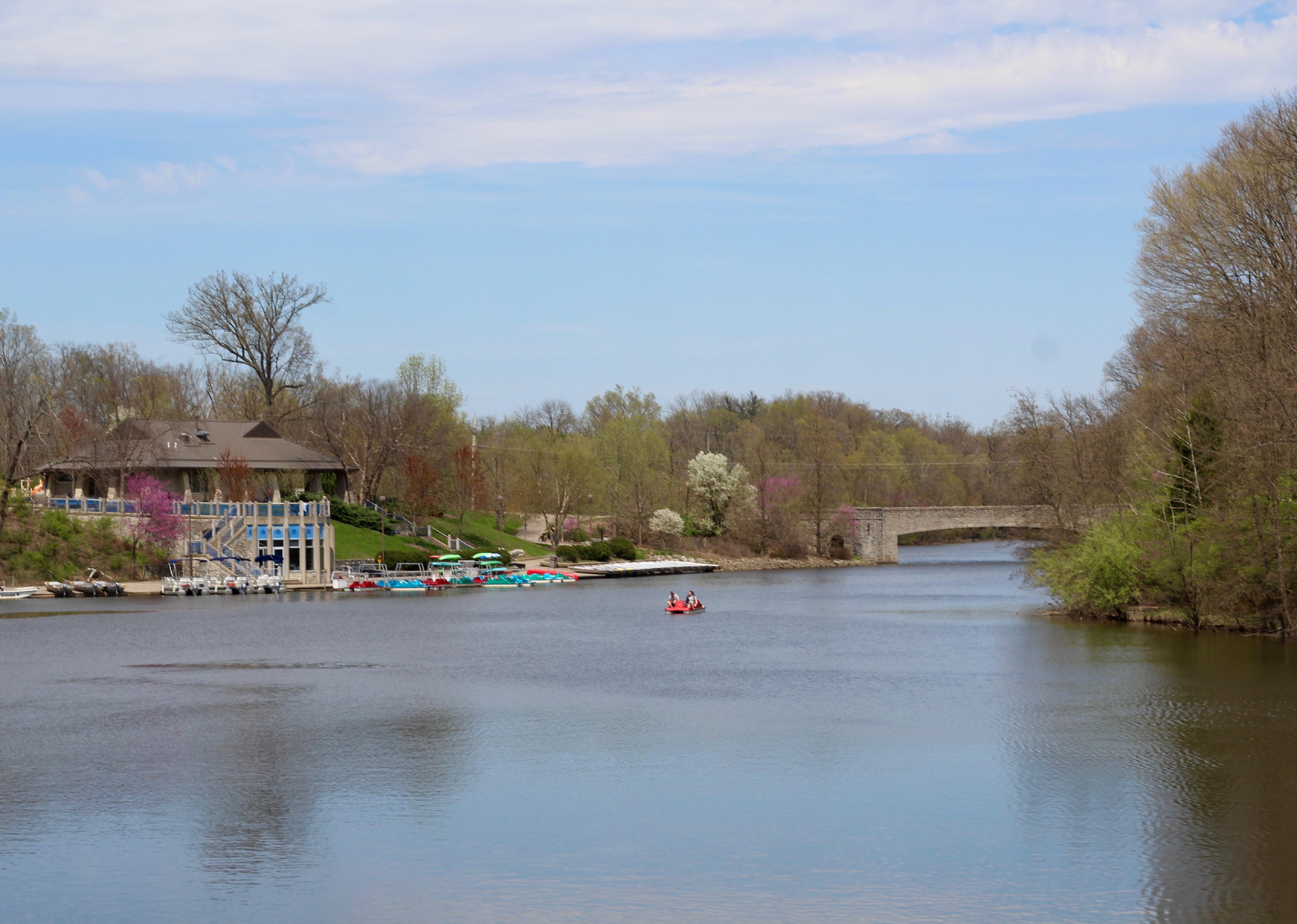 A view of the lake and a boathouse at a park in Hamilton County Ohio