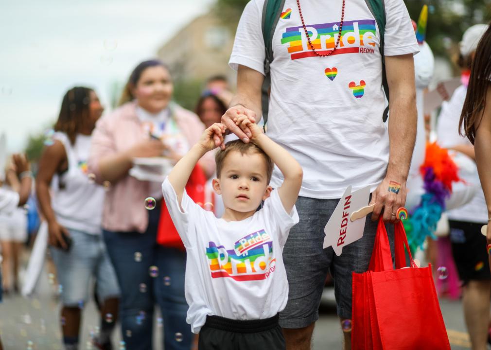 Child wearing pride shirt at parade