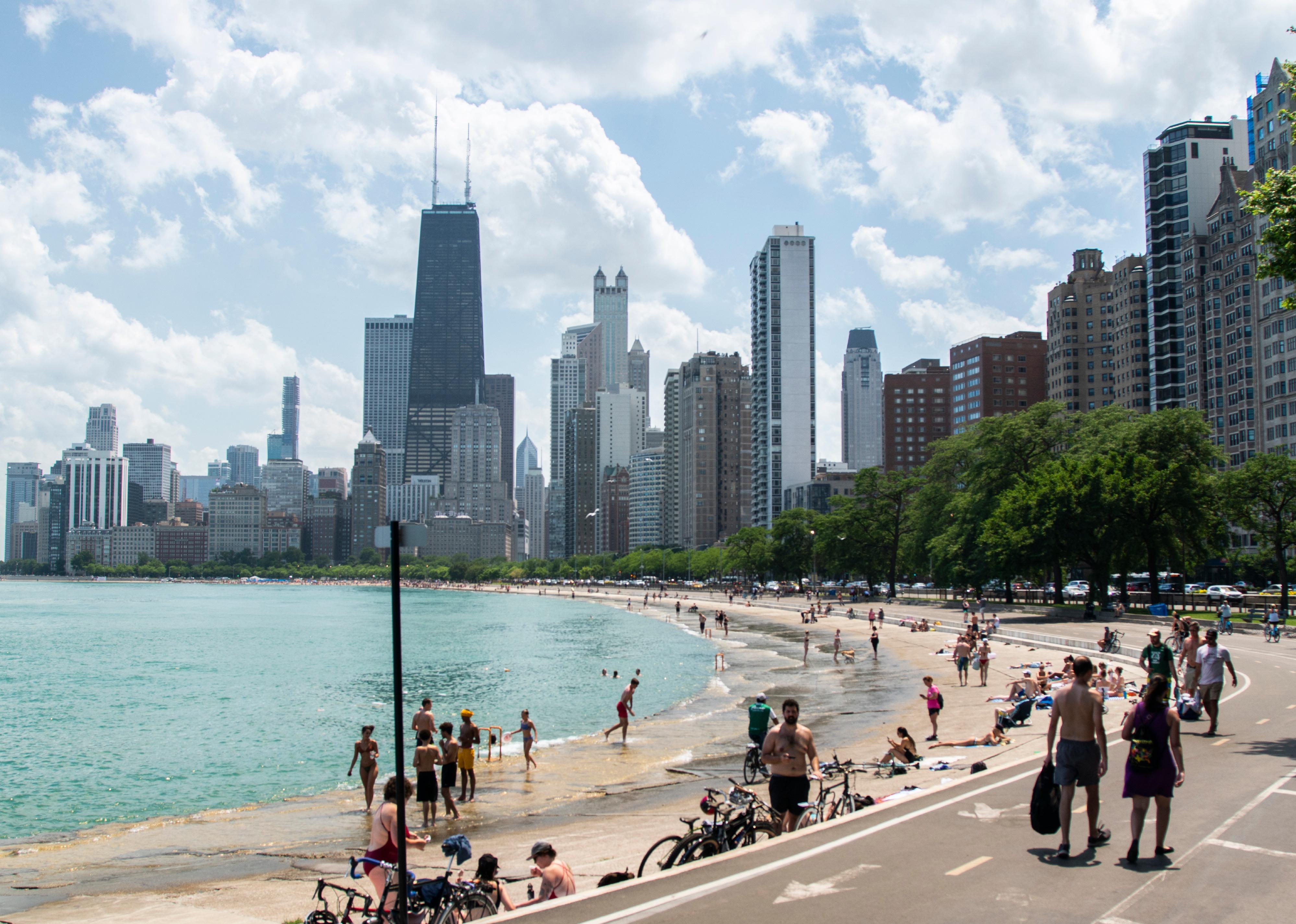 Tourists walking along a shoreline in Chicago