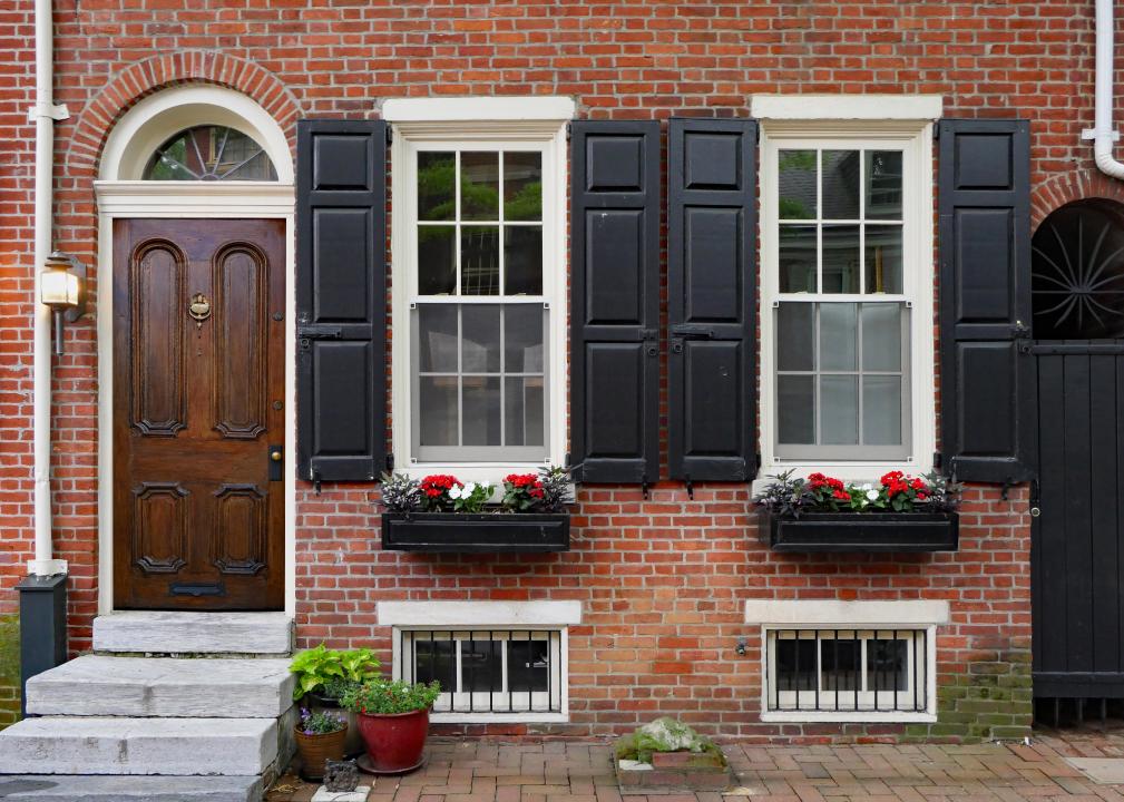 An exterior view of a brick row house.