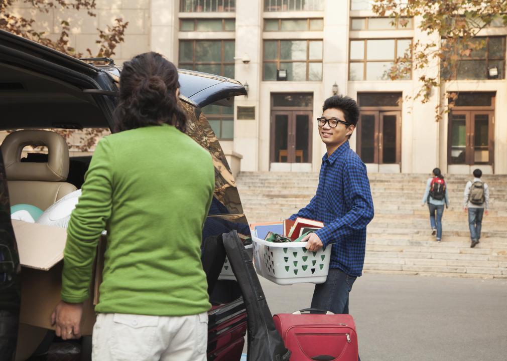 Young man moving into dormitory 