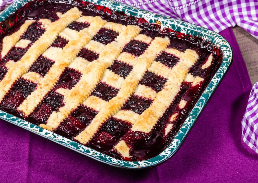 Fresh homemade marionberry cobbler in pan.