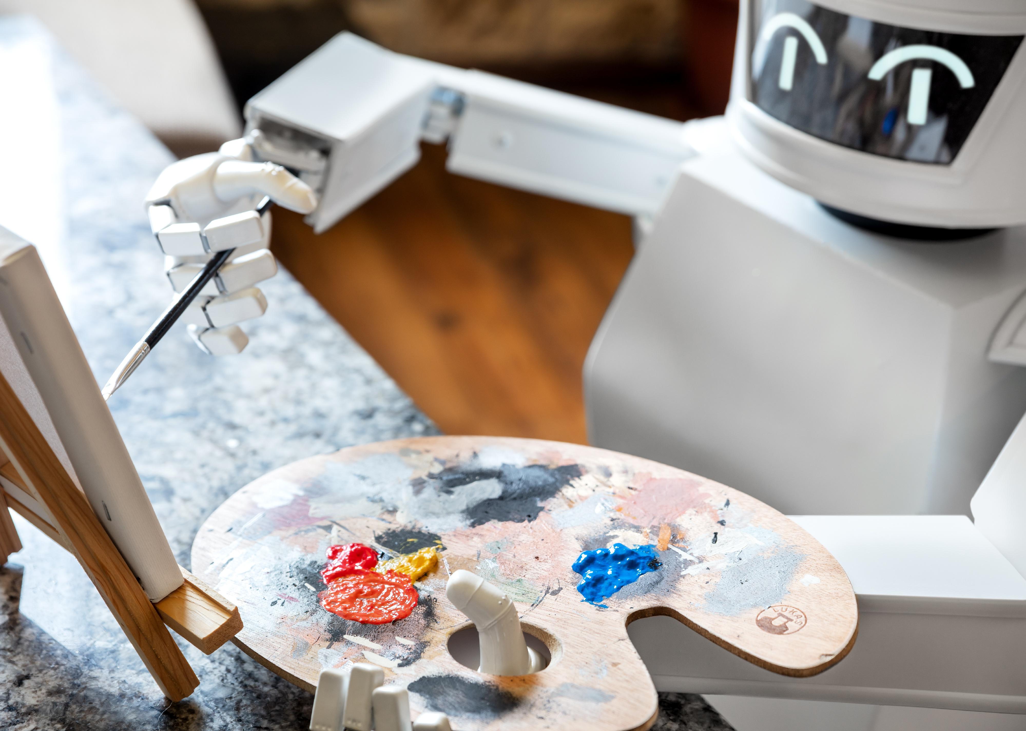 A robot painting a canvas.
