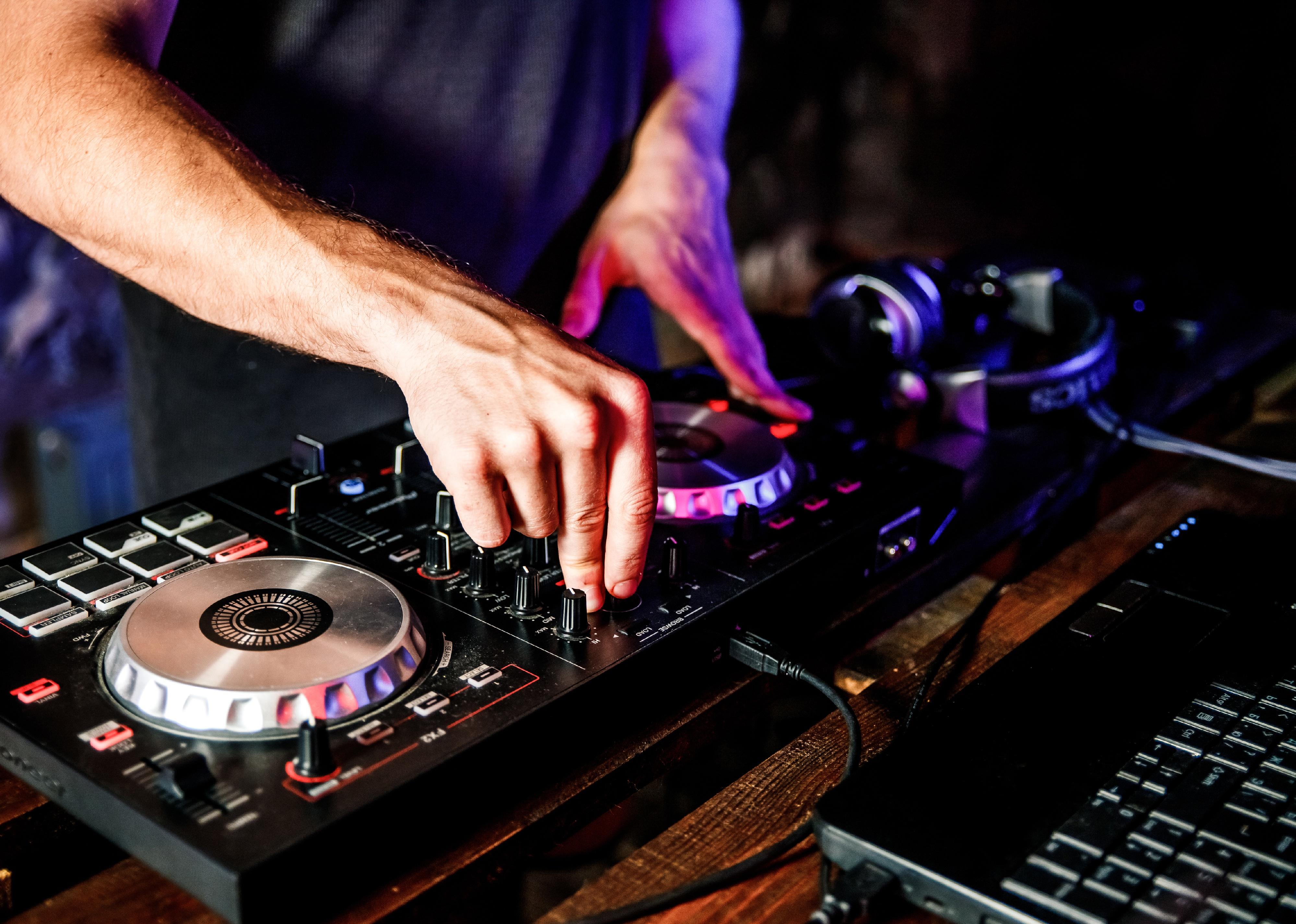 A DJ uses a digital turntable.