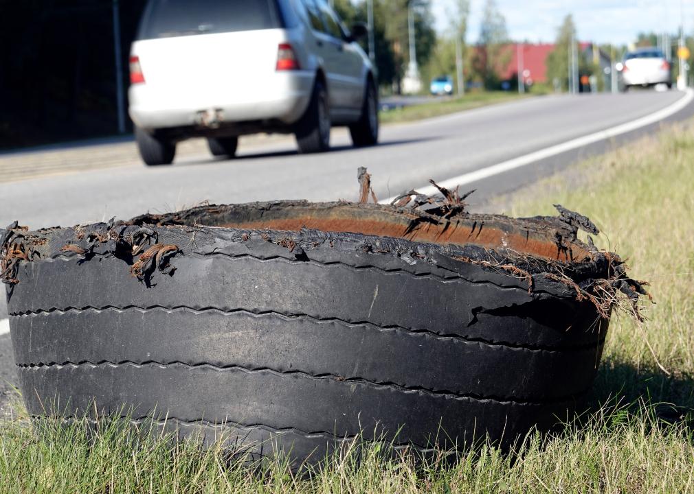 Exploded tire of semi truck on highway roadsid