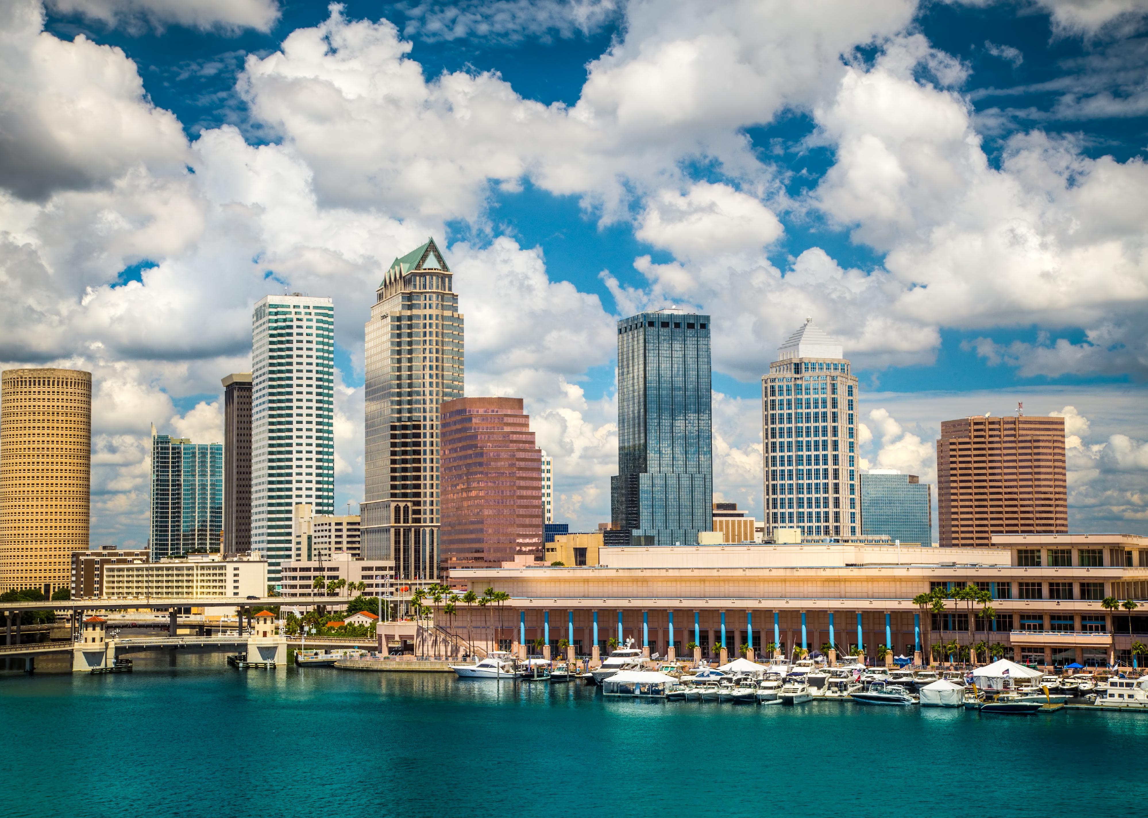 Tampa, Florida skyline with sun and clouds.