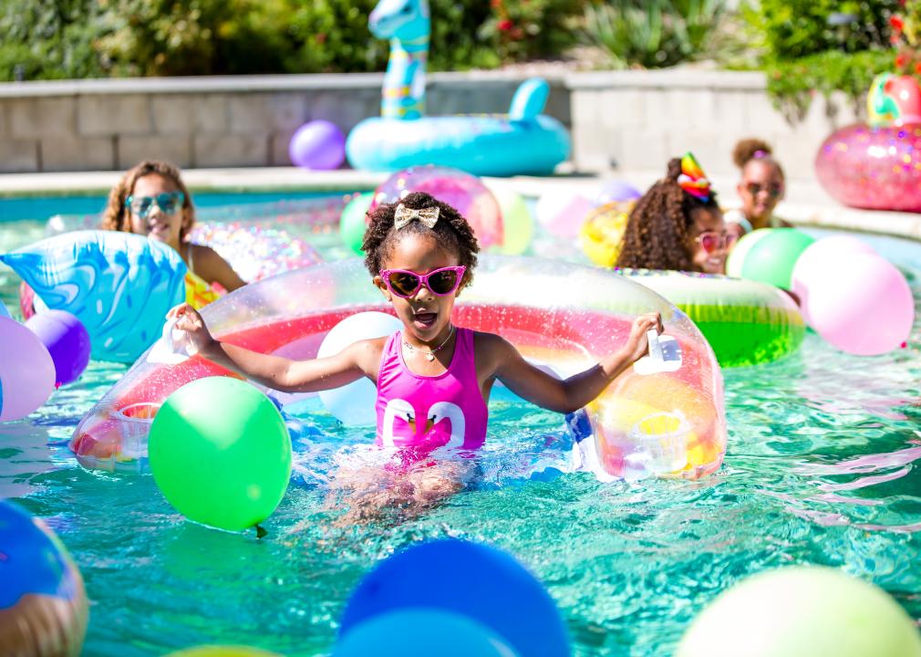 Little girl on pool inflatable.