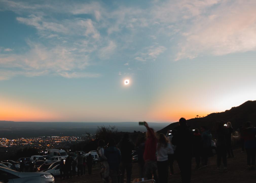 A crowd gathers to watch a total solar eclipse in Argentina.