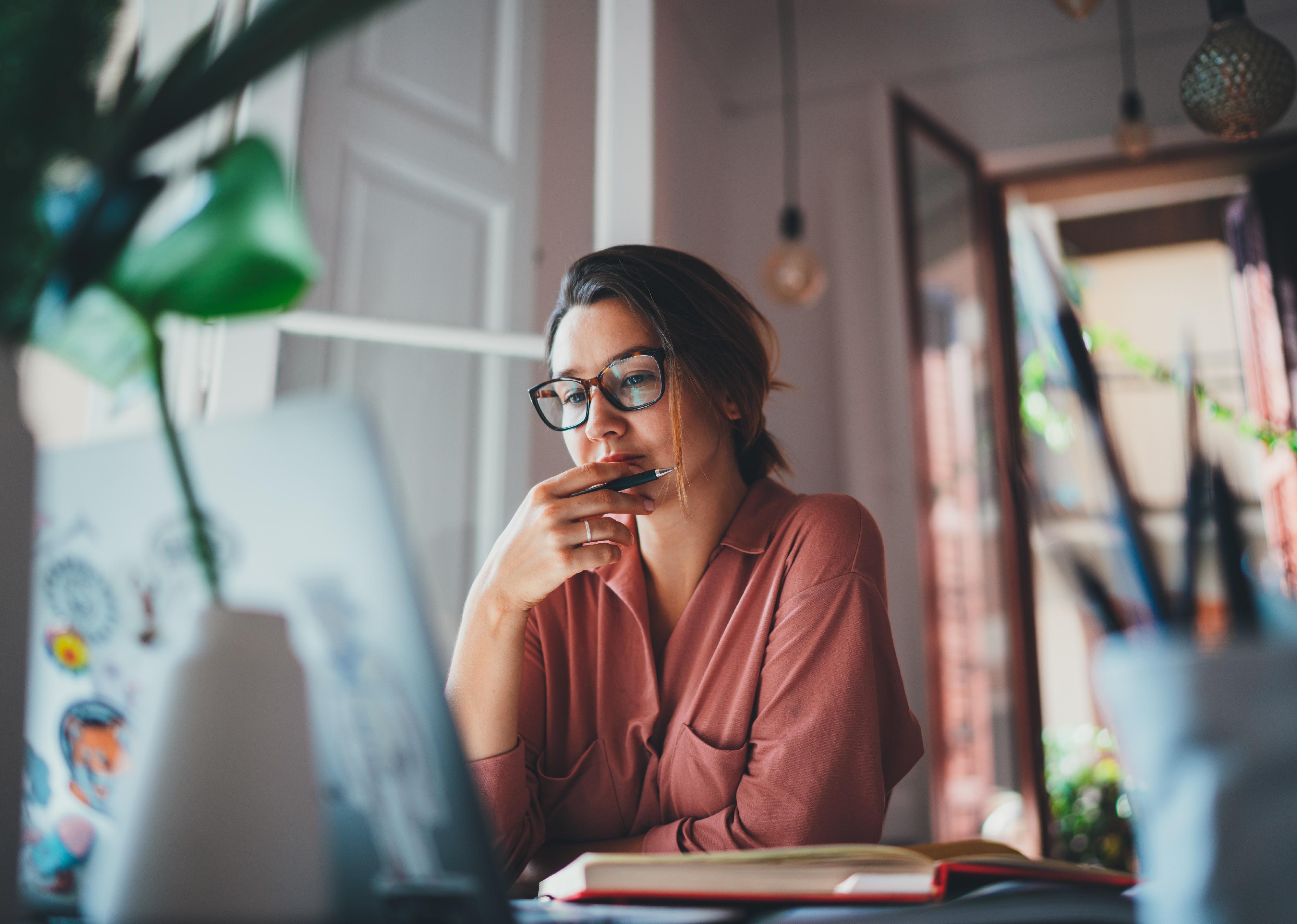 Young businesswoman sitting in front of laptop computer